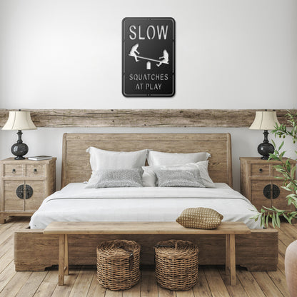 Slow, Sasquatch at Play Metal Art Sign