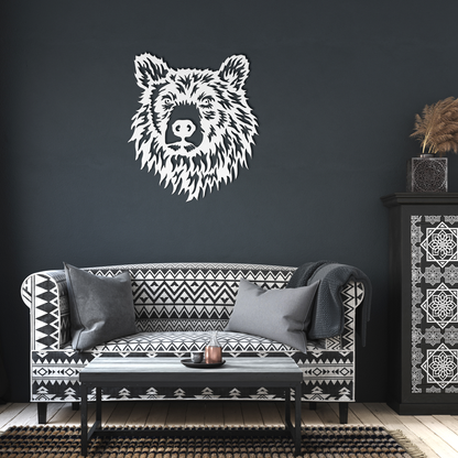 A white bear head wall decal is displayed on a dark charcoal wall above a modern black and white patterned sofa in a styled living room setting.