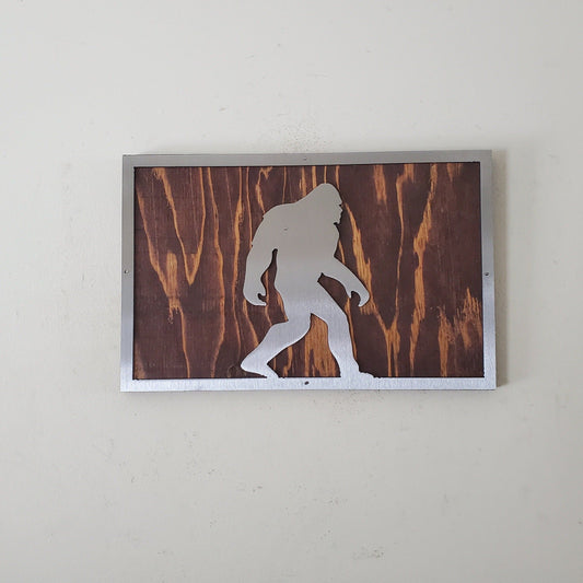 Bigfoot metal art on wood sign