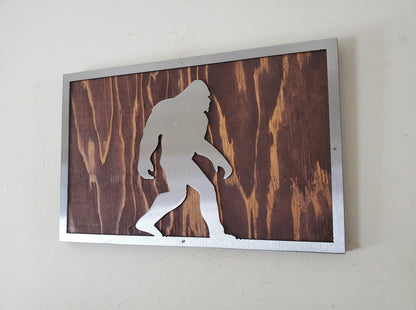 Bigfoot metal art on wood sign
