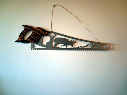 Whitetail deer hand saw wall art, two bucks in a wilderness scene cut out of saw-shaped steel (1)