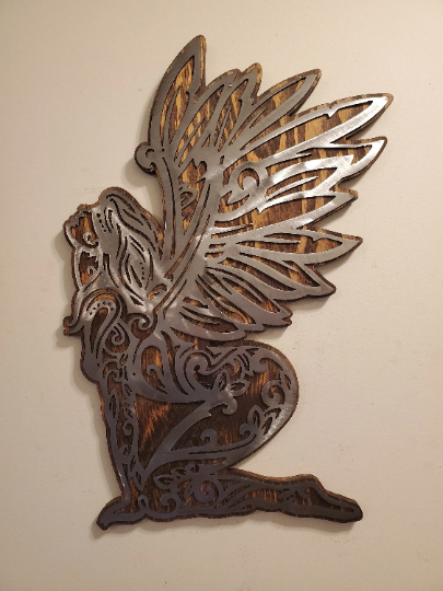 Enchanting Fairy Metal Art on Rustic Wood