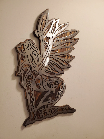 Enchanting Fairy Metal Art on Rustic Wood