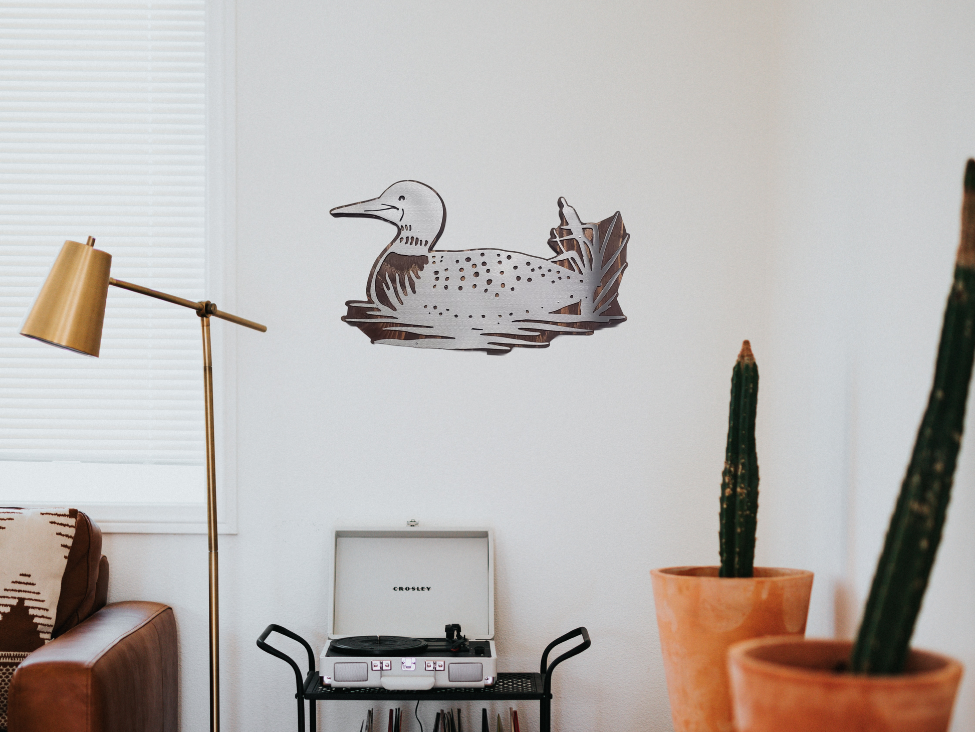 loon metal art on a wall