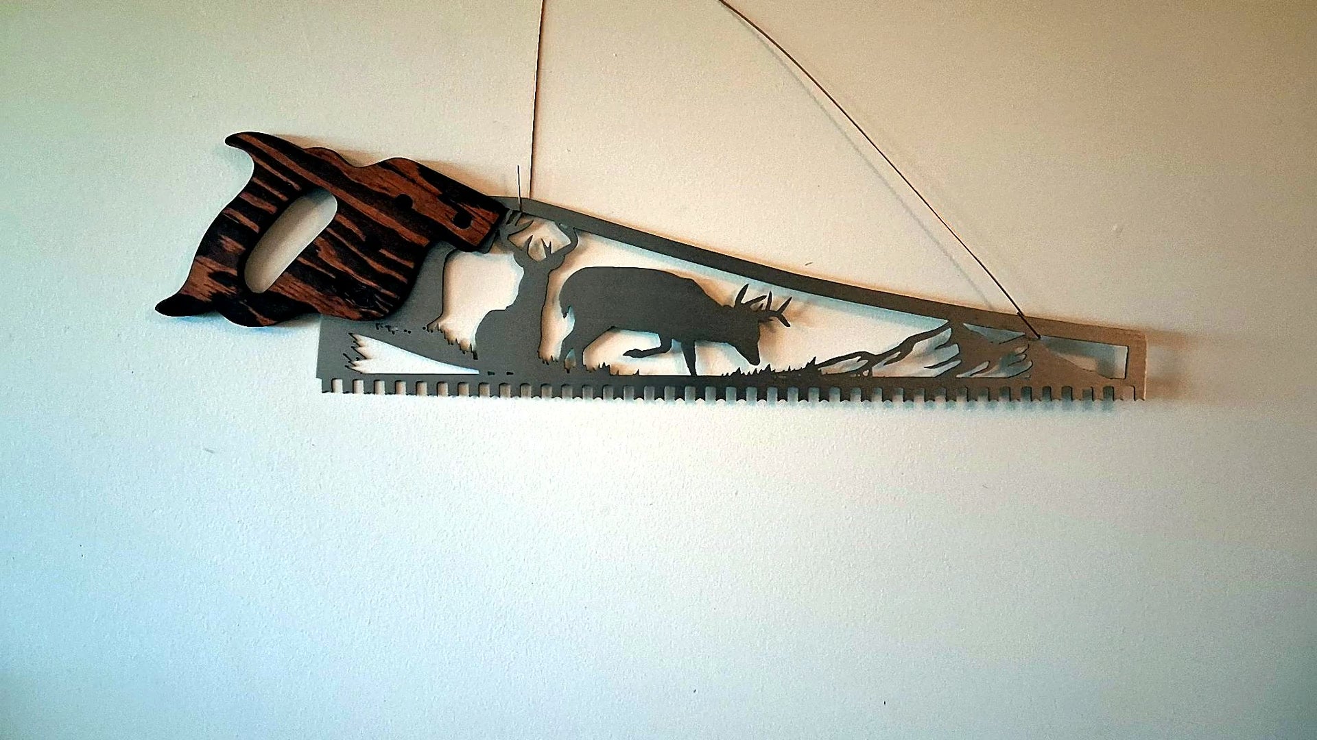 Whitetail deer hand saw wall art video, two bucks wilderness scene