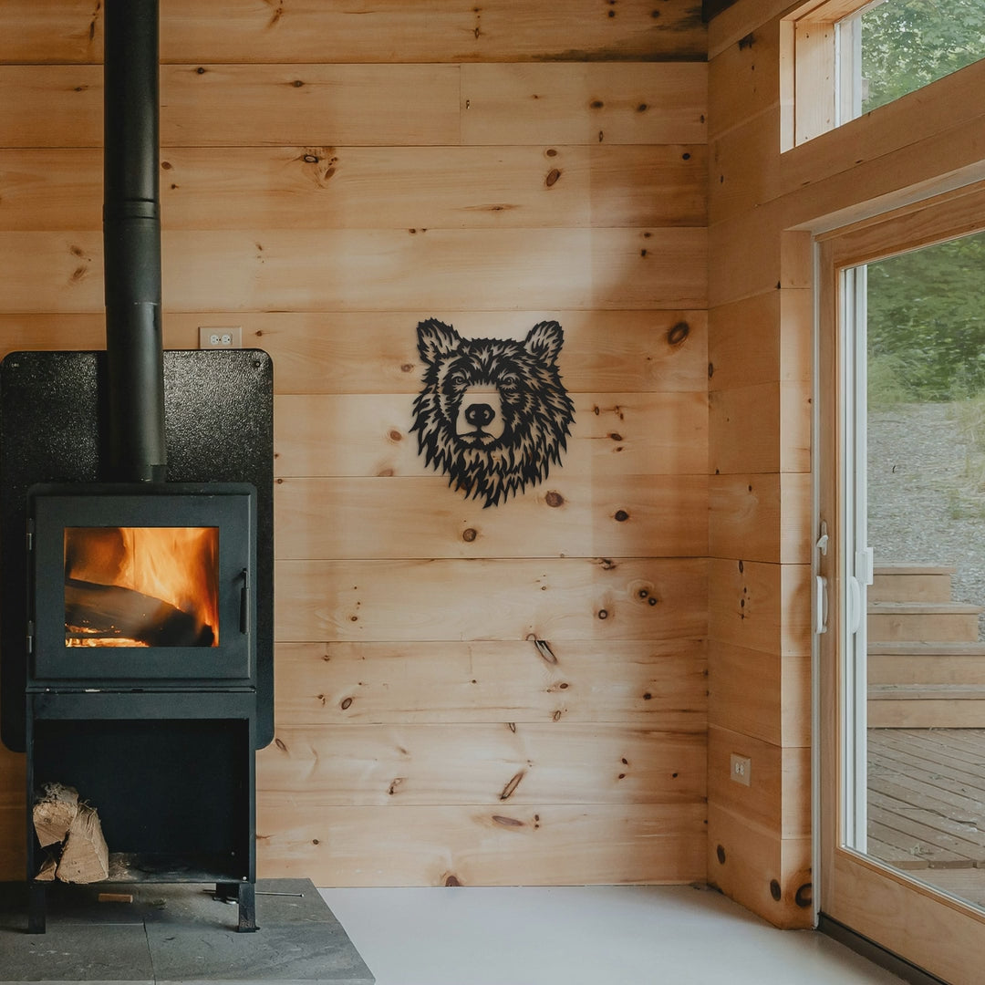 Bear head metal art on cabin wall