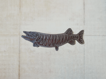This Muskie fish sculpture art is a beautiful and unique wall decor piece, featuring an artistic representation of the elusive and challenging king catch - the Muskie. It is made using rustic stained wood and clear-coated steel