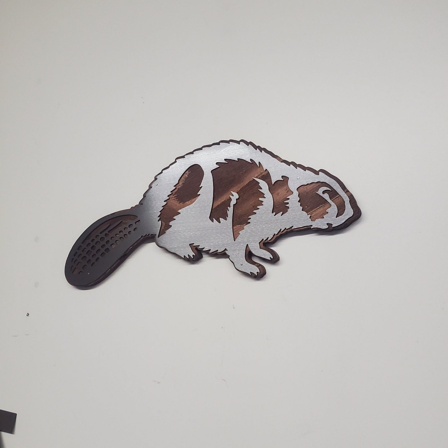 Beaver metal art on wood