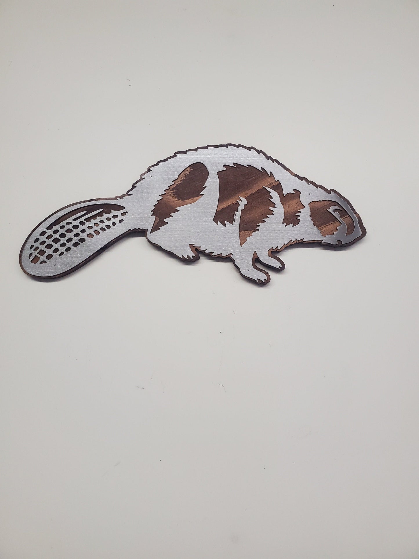 Beaver metal art on wood