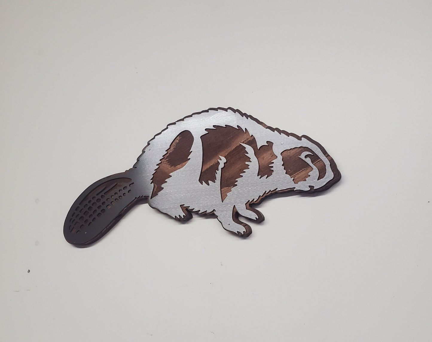 Beaver metal art on wood