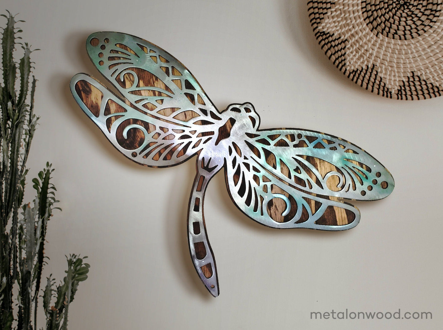  beautiful Dragonfly metal and wood wall sculpture, the perfect addition to any home looking for a unique piece of metal art home decor. This sculpture is made in our family shop in Minnesota, using rustic stained wood and clear-coated steel.