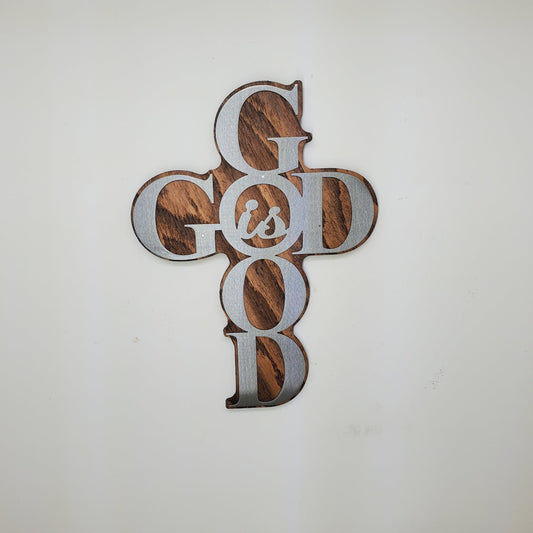 God is Good Religious Cross Sculpture Metal Art! This beautiful piece is perfect for adding a touch of inspiration to any room in your home. Made with rustic stained wood and clear-coated steel, it features a cross shape from the words "God is Good"
