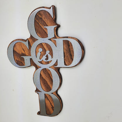 God is Good Religious Cross Sculpture Metal Art! This beautiful piece is perfect for adding a touch of inspiration to any room in your home. Made with rustic stained wood and clear-coated steel, it features a cross shape from the words "God is Good"