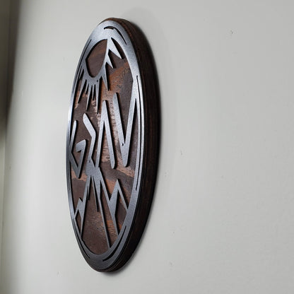 God is Greater Than the Highs and Lows Greek letters and mountains  metal art on stained wood circle design
