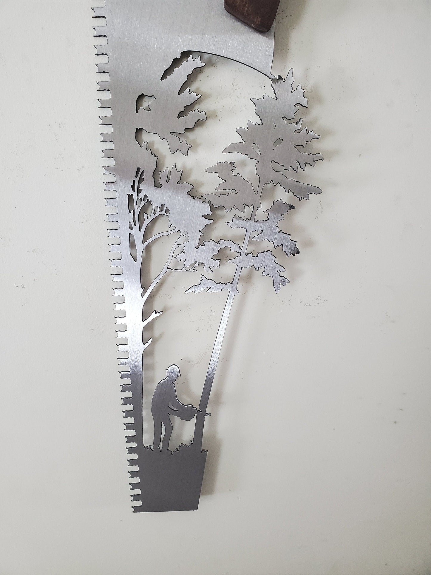 close up of detail on saw cut out with tree