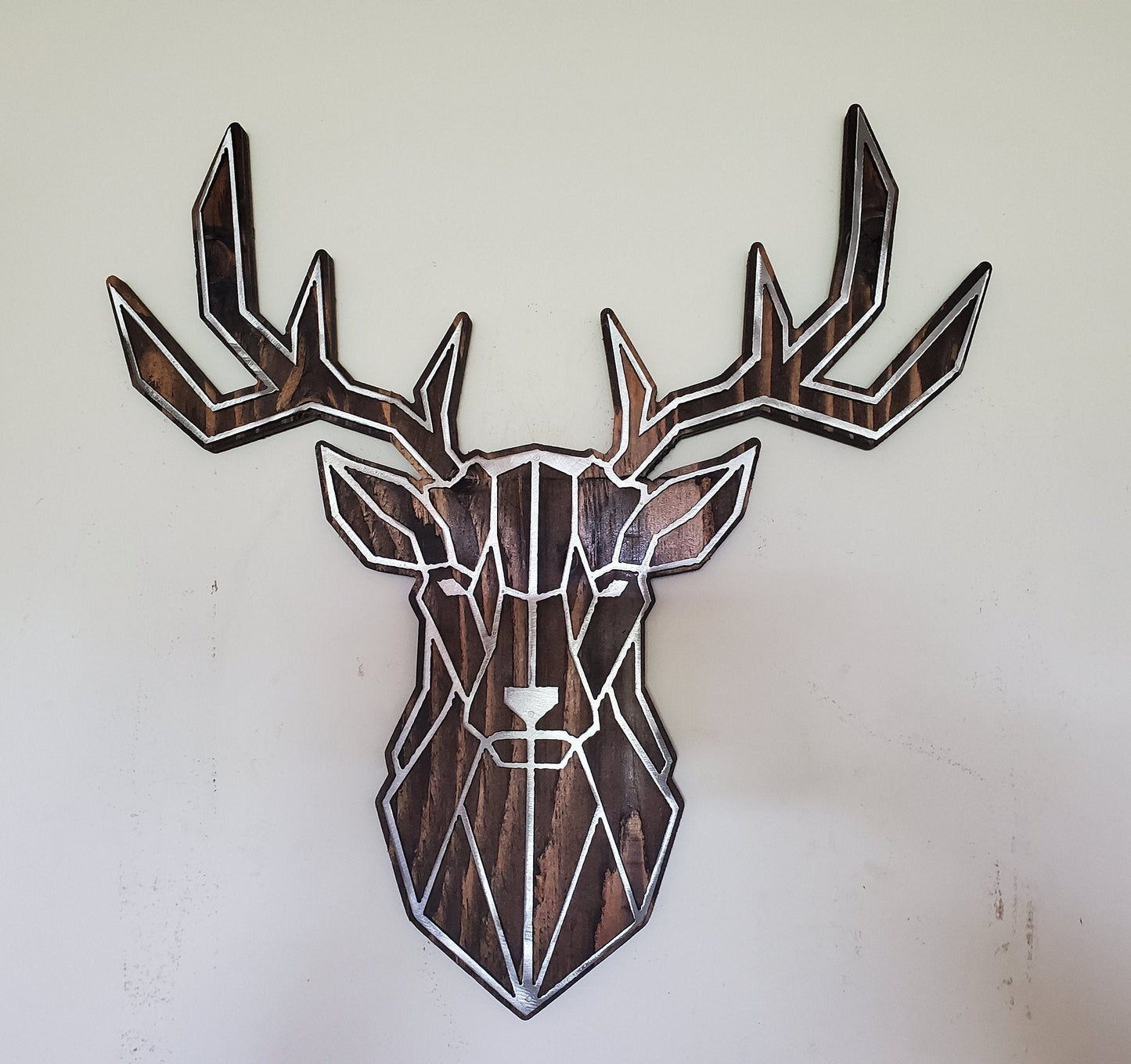 Geometric Buck Head Metal Art on Rustic Stained Wood
