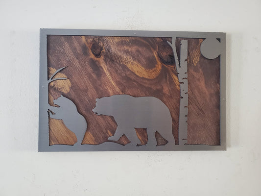 A close-up of a bear scene metal art wall decor made of clear coated steel, featuring intricate details and textures of a bear in its natural habitat. A perfect addition to any nature lover's home or office decor.