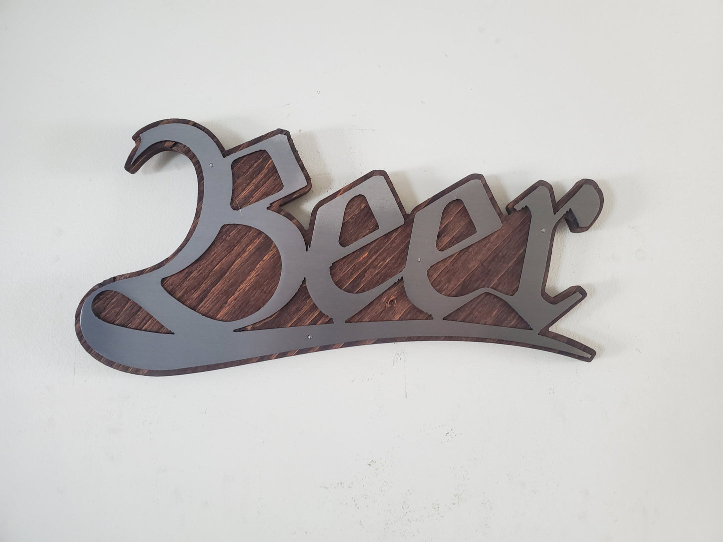 Beer stylized word metal art on stained wood decor