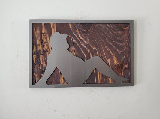 Metal cut-out sculpture of a Dad Bod physique, mounted on a rustic stained wood background, suitable for indoor display, easy to hang