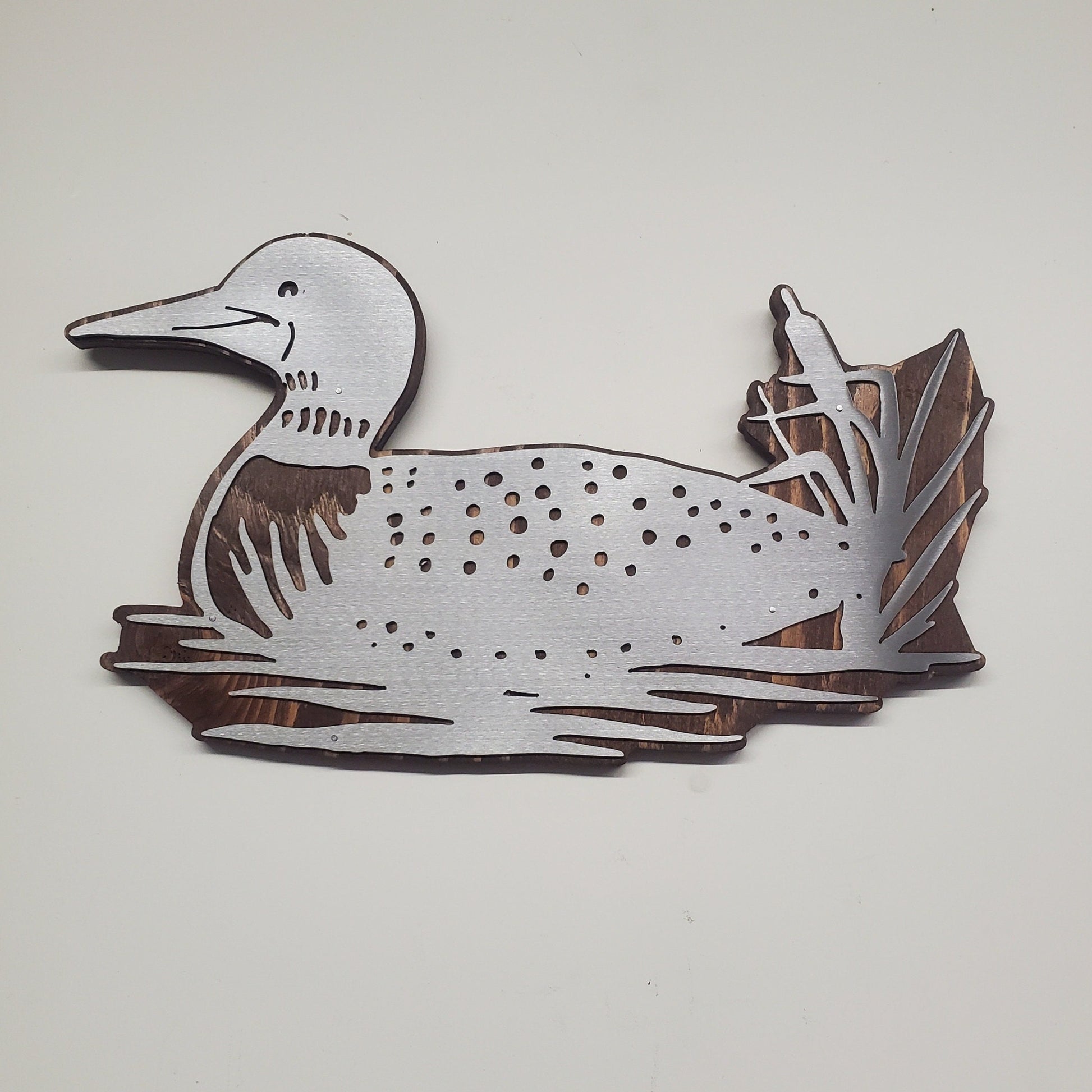 The metal art loon is made from high-quality steel and is very durable. It is created by an artist from Minnesota, so you can be sure that the product is made with care and attention to detail