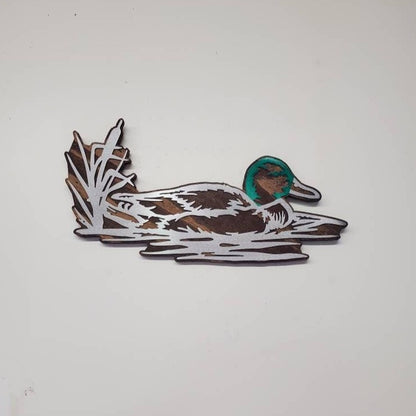 metal art duck on wood