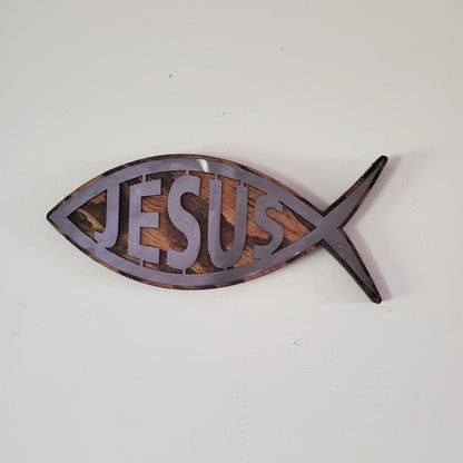 Fish symbol metal art on wood