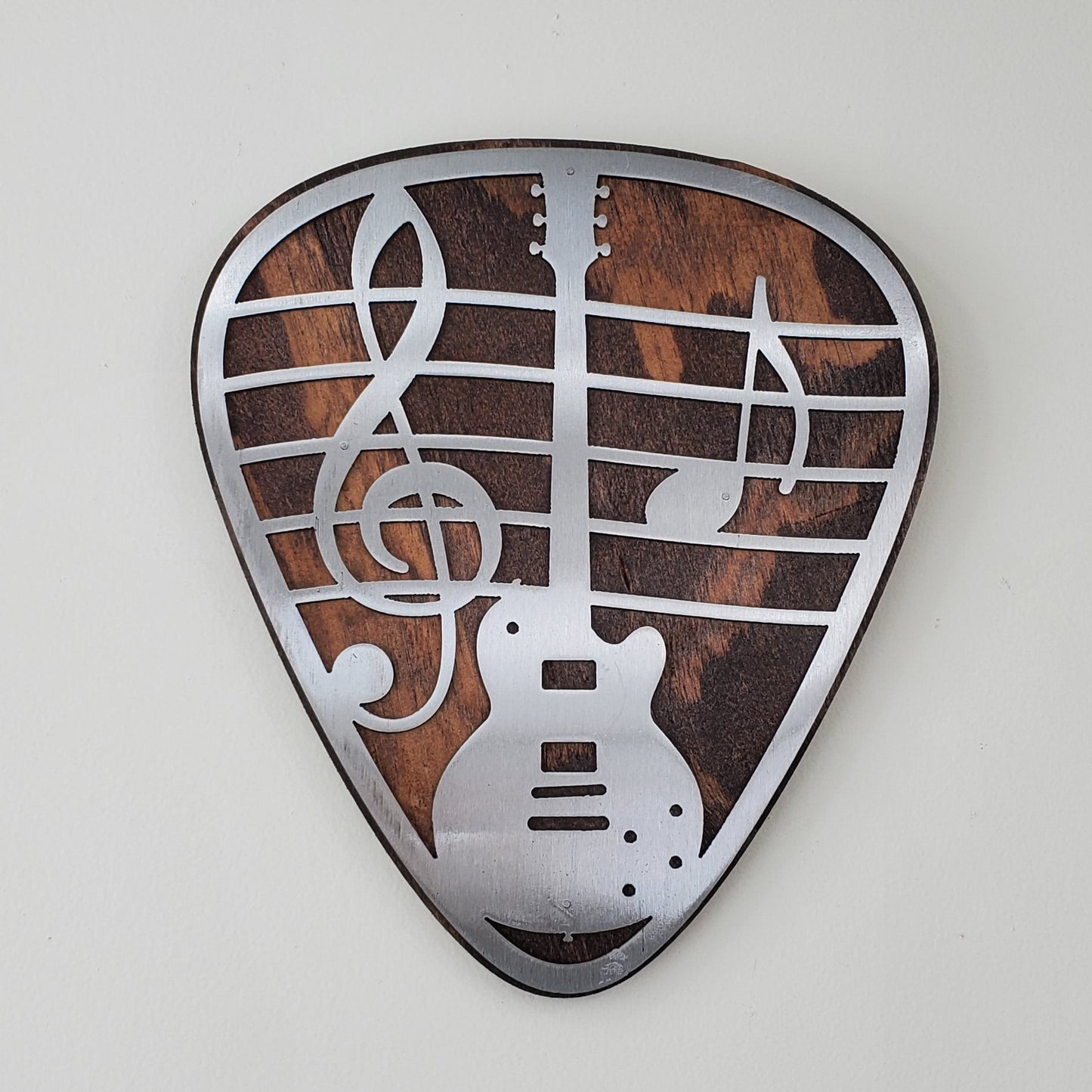 guitar pick metal art on wood beamish metal works 